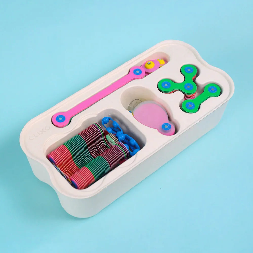 Colorful Clio set in a storage box on a light blue background