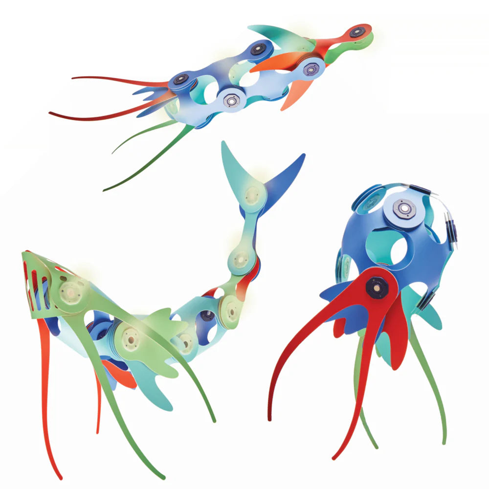 Colorful toy vehicles resembling fish on a white background