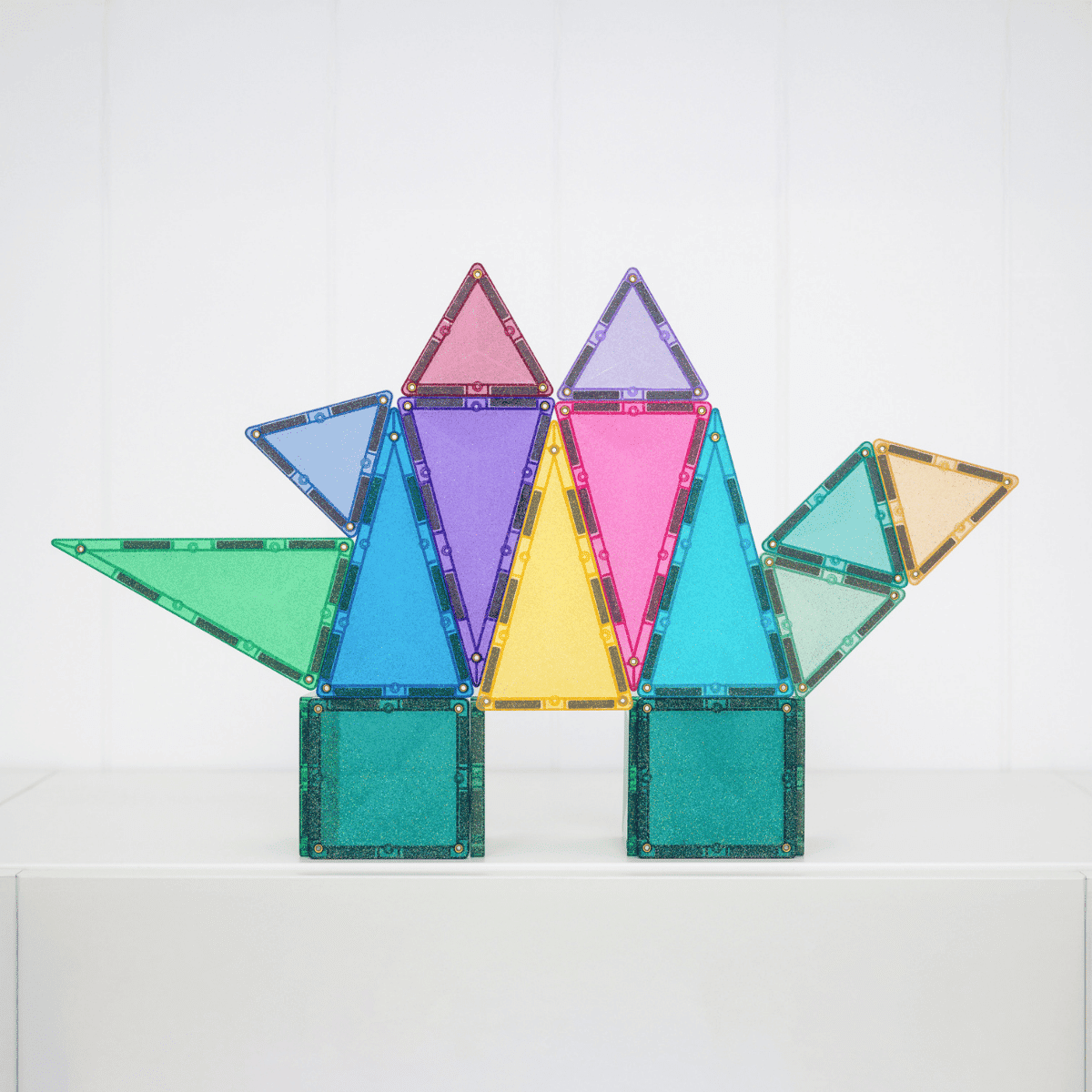 Colorful magnetic building blocks on a white background
