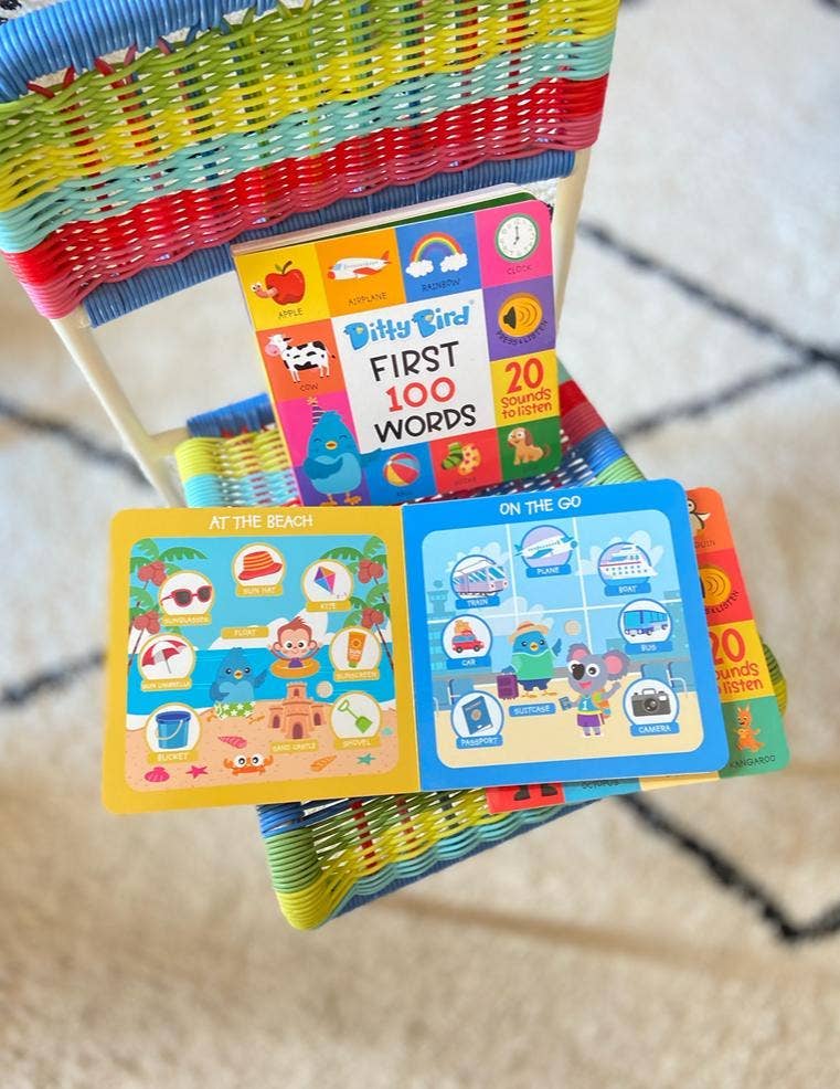 Stack of colorful children's books with various illustrations on a textured surface.