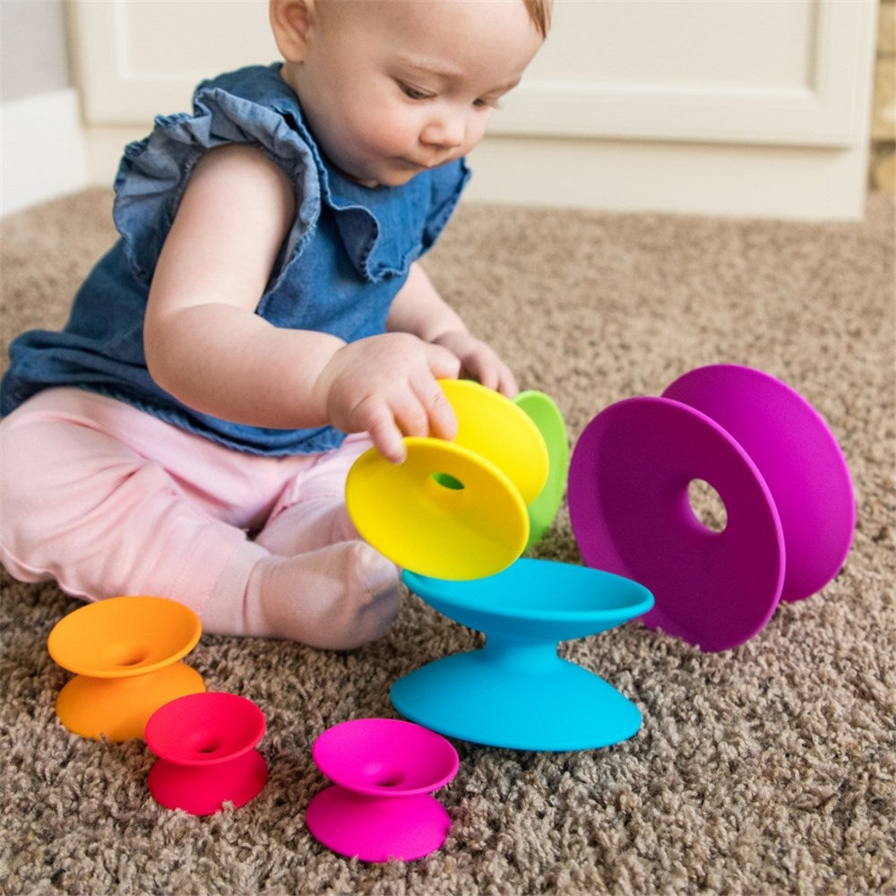 Baby playing with Fat Brain Toys - Spoolz
