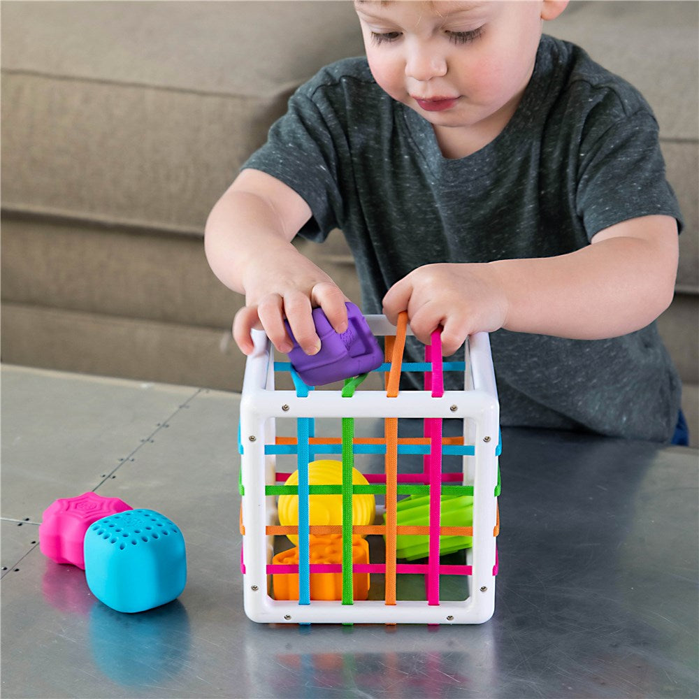 Child playing with Fat Brain Toys - InnyBin