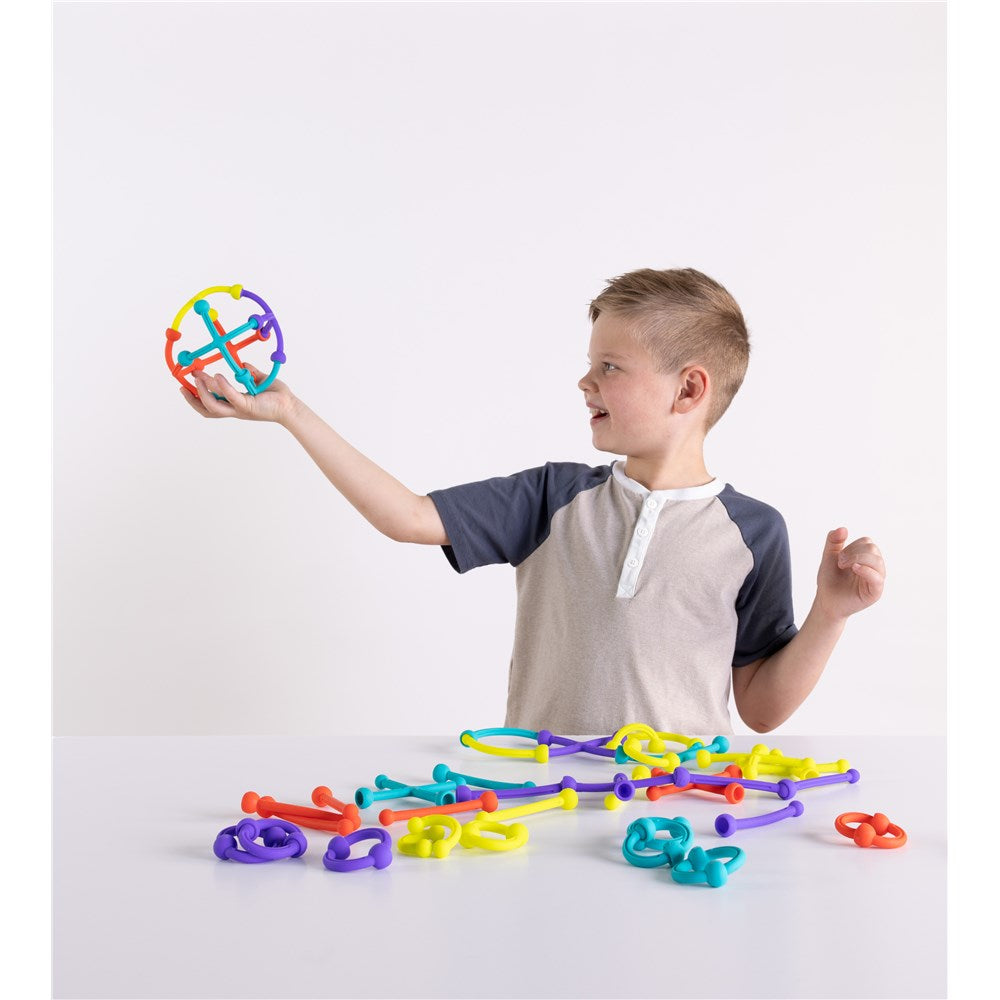 Child playing with Fat Brain Toys - Plip Kit