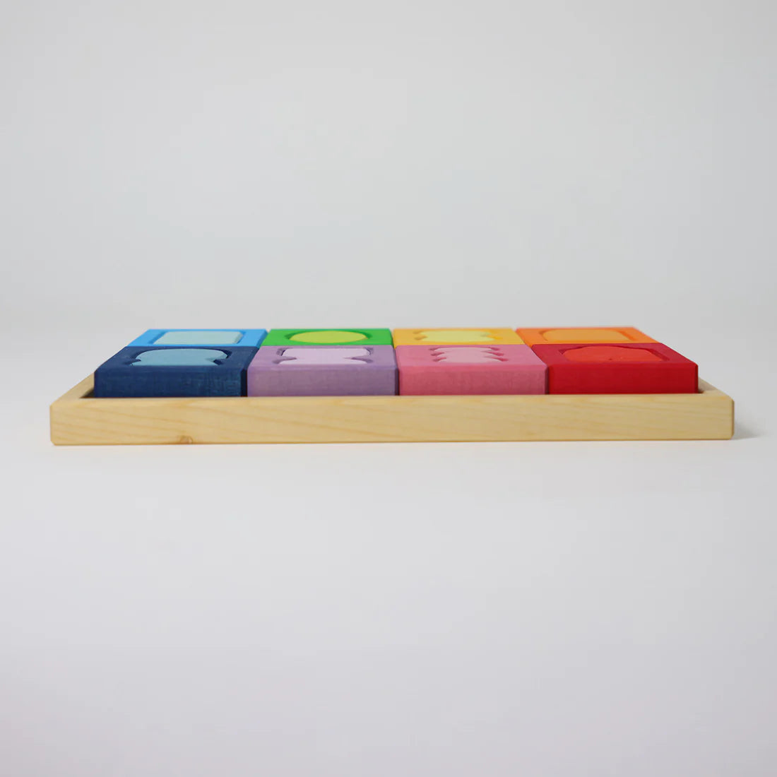 Colorful wooden blocks on a light gray background
