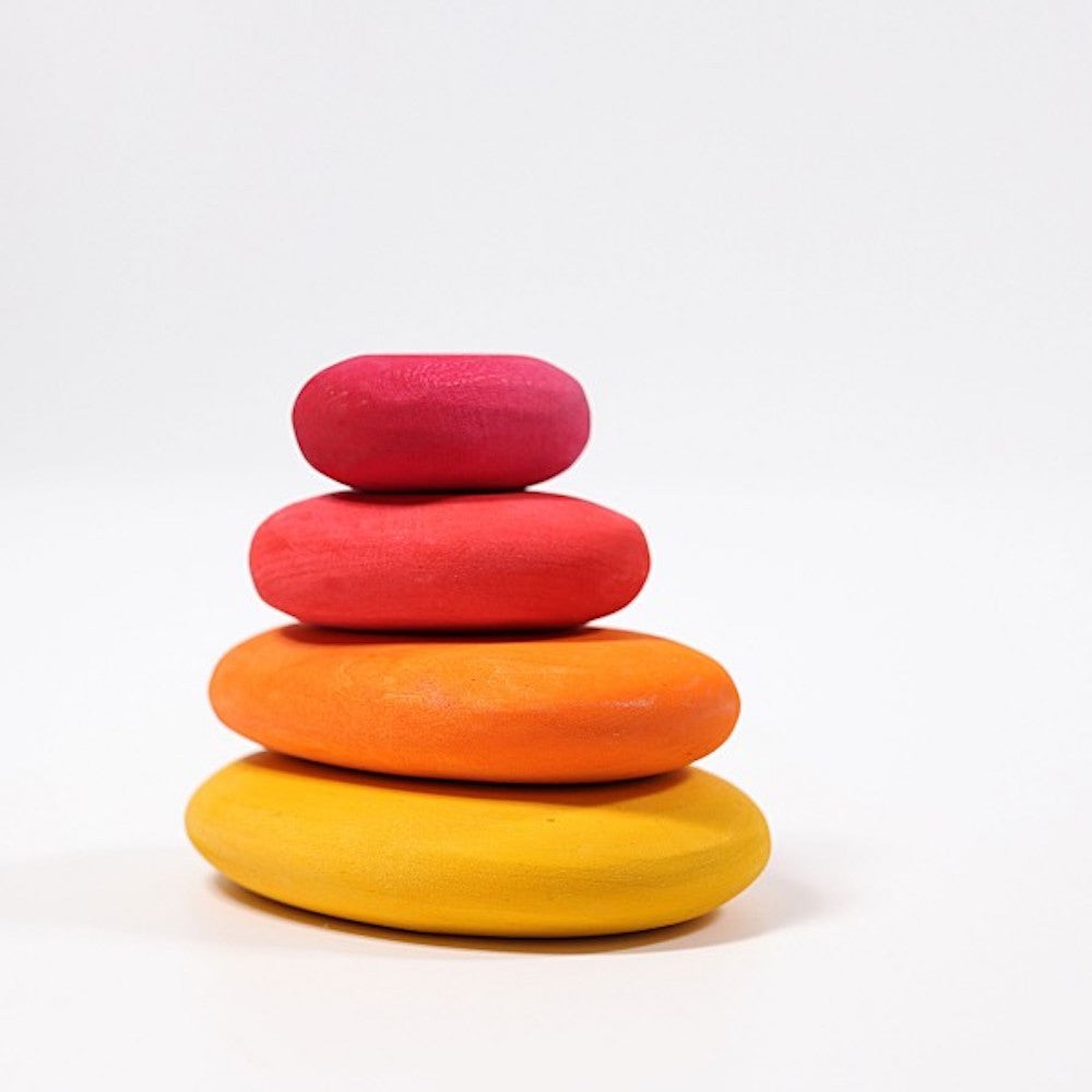 Stack of colorful pebbles on a white background