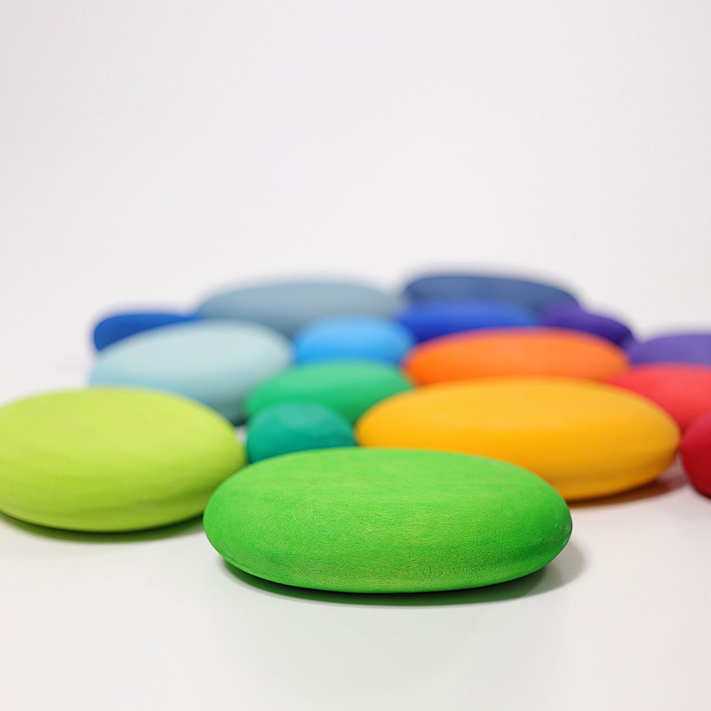 Colorful oval-shaped objects on a white background