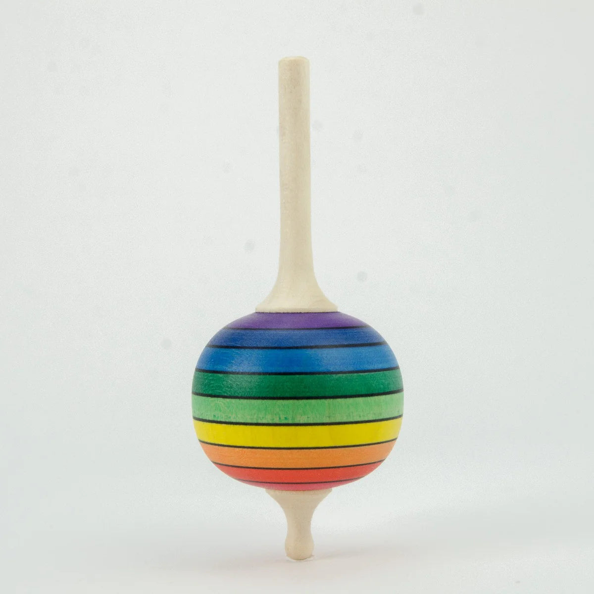 Colorful striped wooden top on a white background