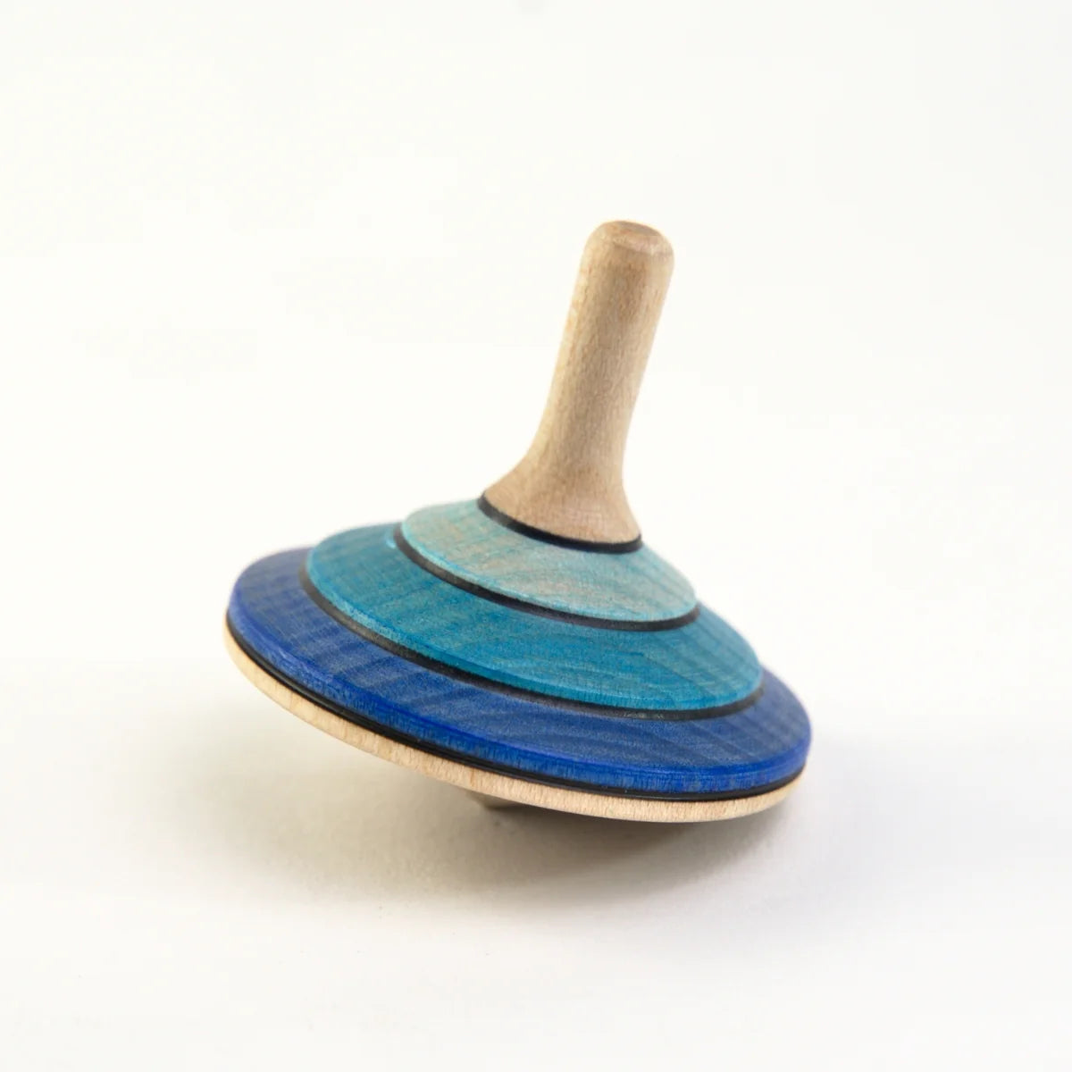 Wooden spinning top with blue striped design on a white background