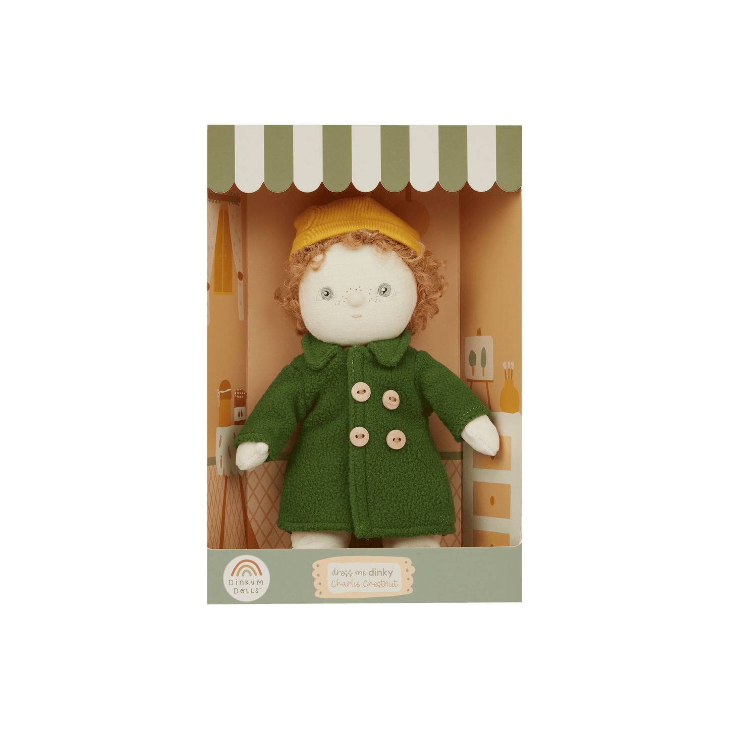 Stuffed toy with a green coat and yellow hat in a box on a white background