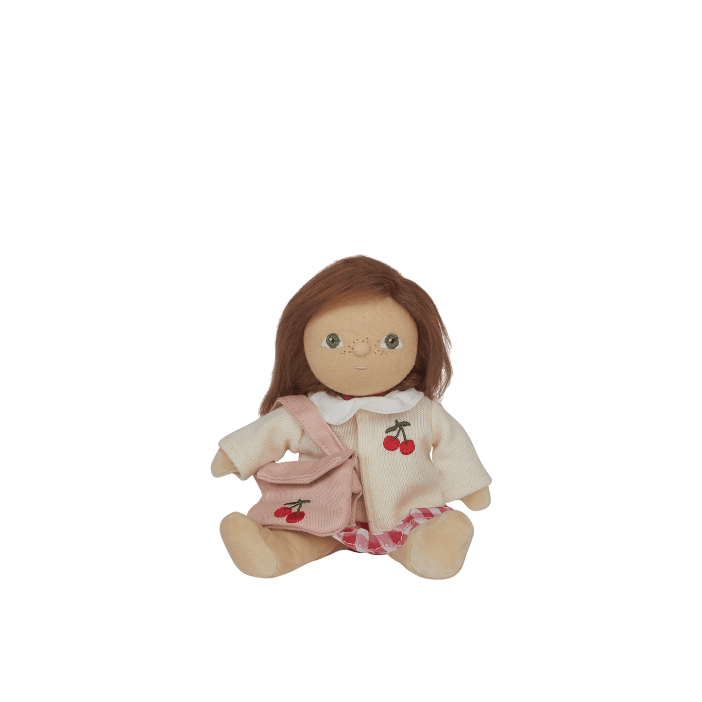 Toy doll with brown hair and a outfit on a white background