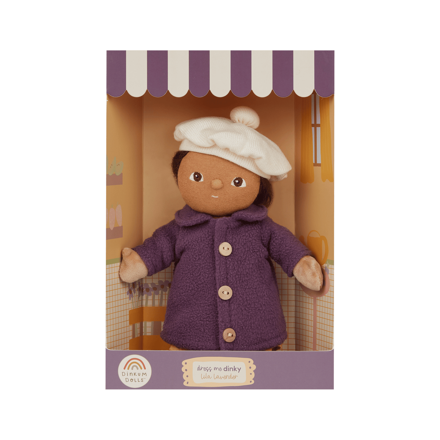 Doll in a purple coat and white hat in a box with a white background