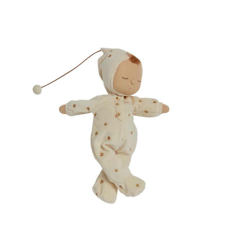 Baby doll in a white outfit with star patterns on a white background