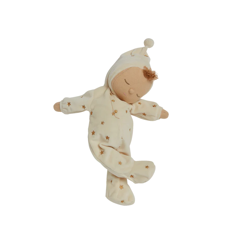 Baby doll in a white outfit with star patterns on a white background