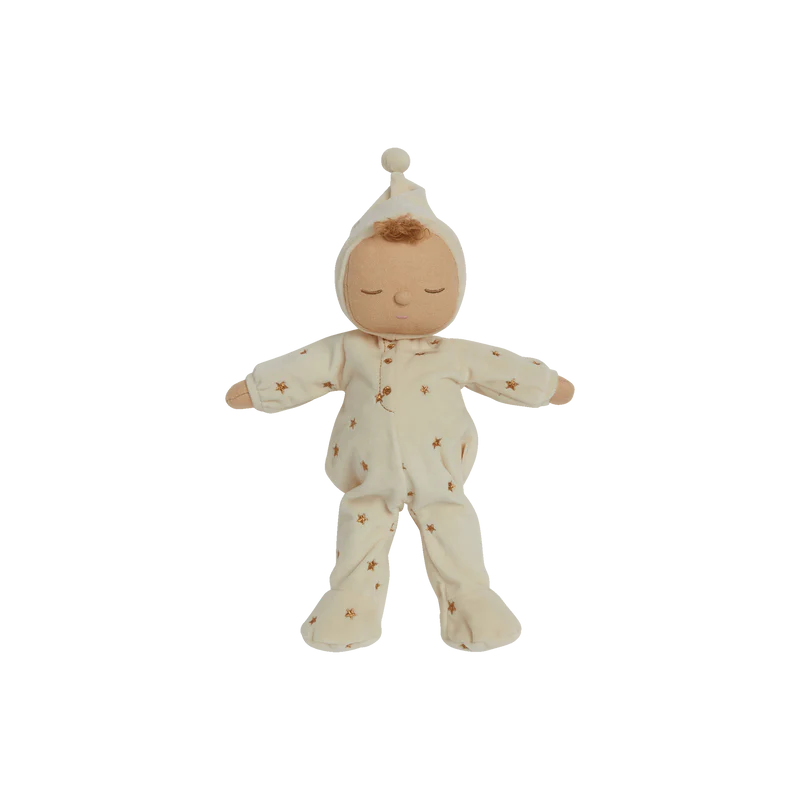 Baby doll in a white outfit with star patterns on a white background