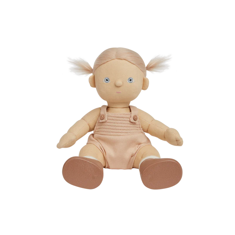 Plush doll with blonde hair in pigtails wearing a beige romper on a white background