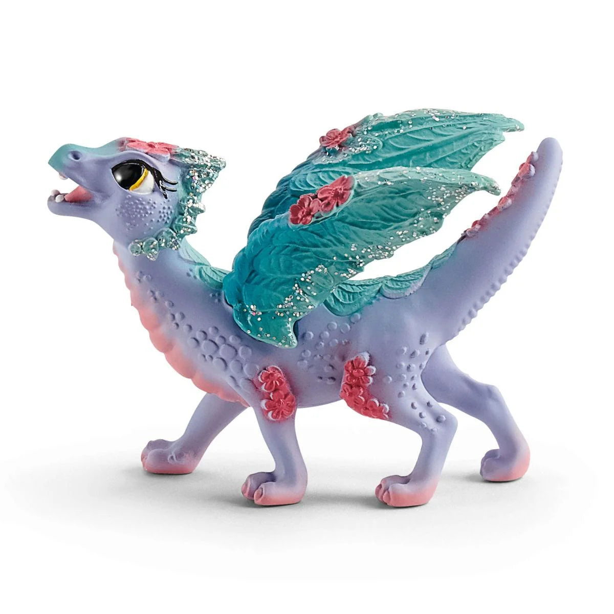 Colorful dragon figurine with floral details on a white background