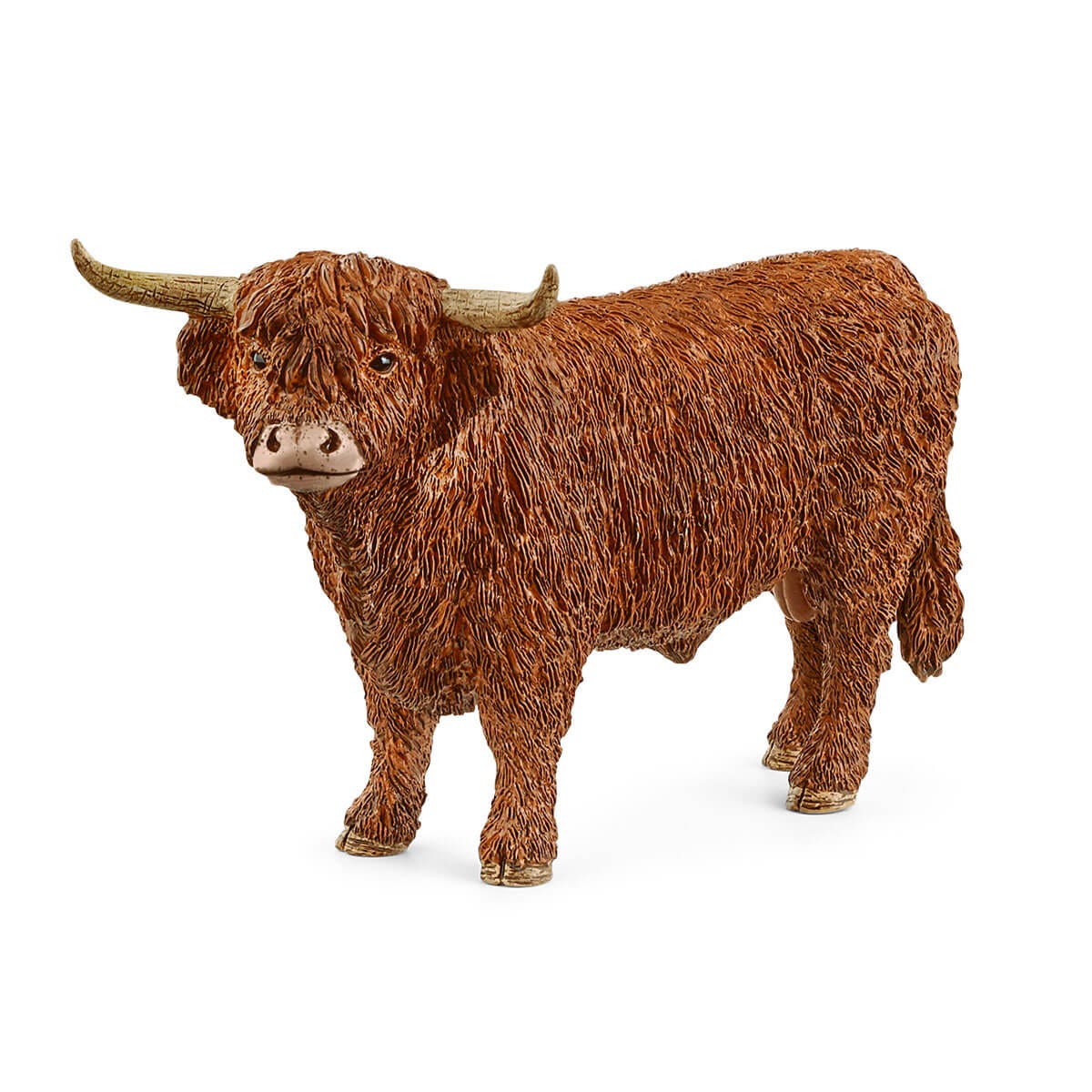 Brown Highland cow figurine on a white background