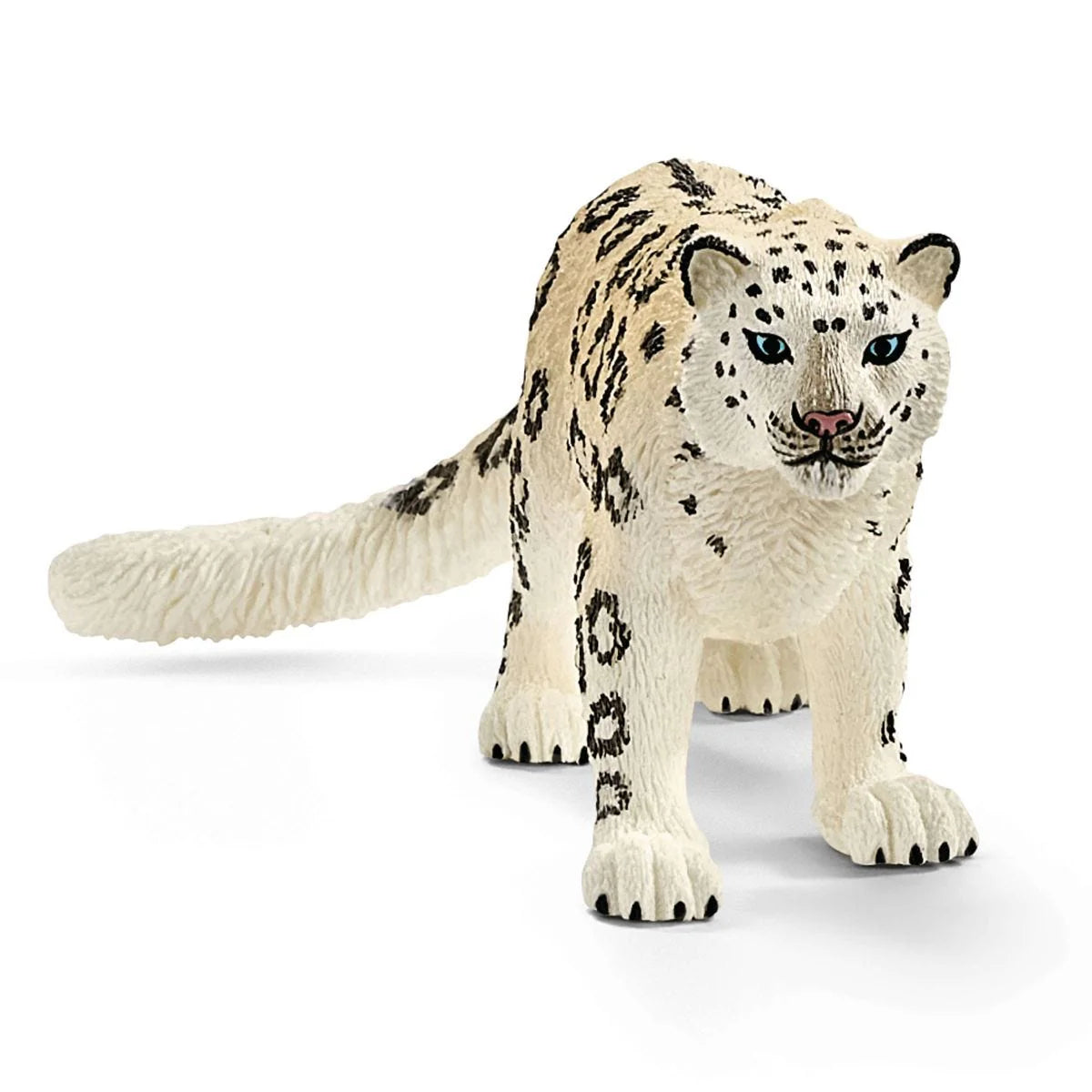 Toy figure of a snow leopard on a white background