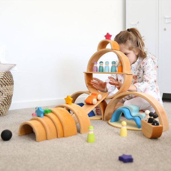 Child playing with Grimm's open ended toys