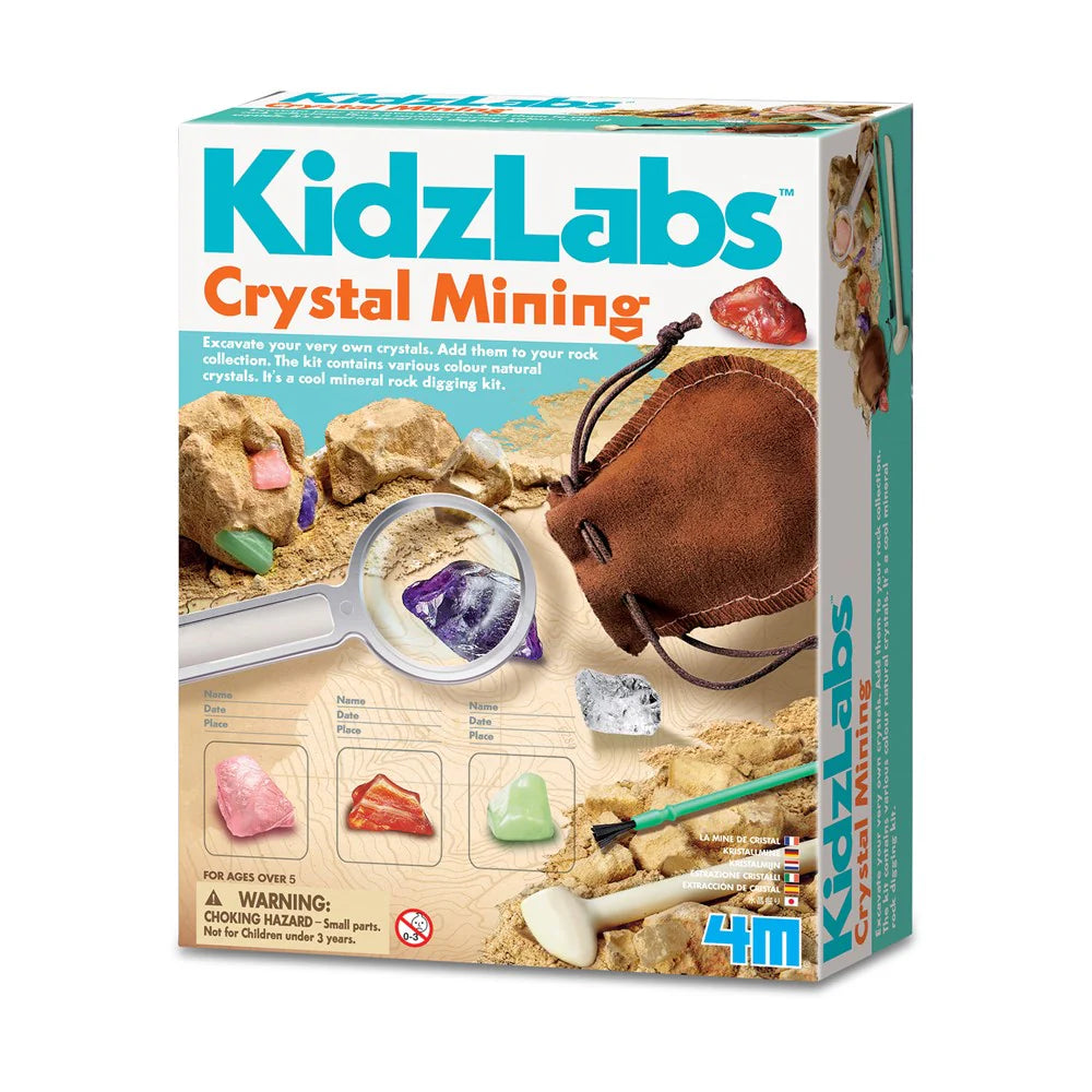 Box of KidzLabs Crystal Mining kit with magnifying glass, crystals, and tools on a white background