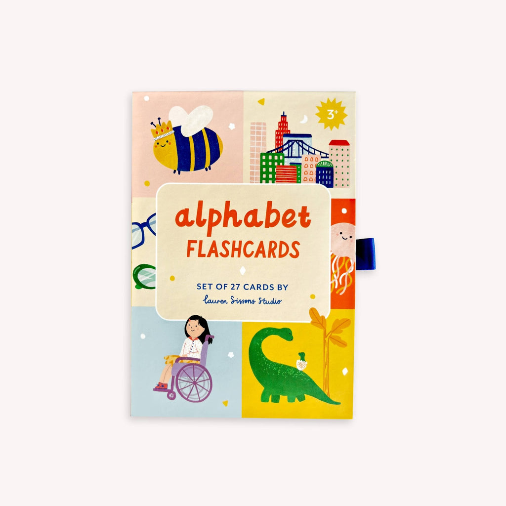 Packaging with colourful images and alphabet flashcards on a white background.