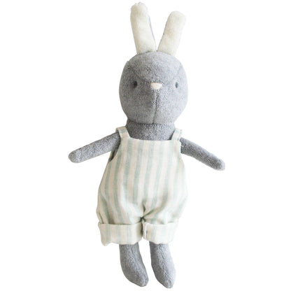 A plush toy bunny with a gray head and body, and a sage green striped overal. The bunny has a tail and two ears, and is depicted in a standing position.