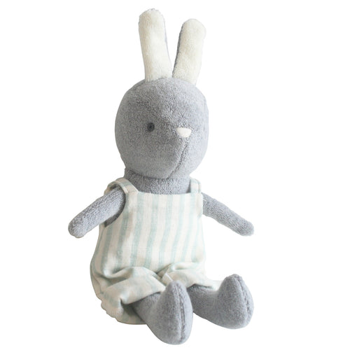 Plush toy rabbit in a white outfit with sage stripes on a white background