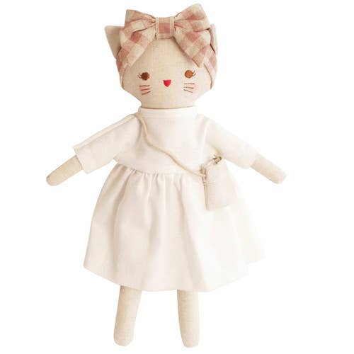 A small doll resembling a kitten with an ivory linen dress and a rose check linen headband, with a cute linen bag.