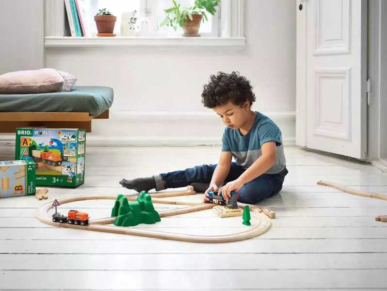 Child playing with BRIO - Starter Lift & Load Set A