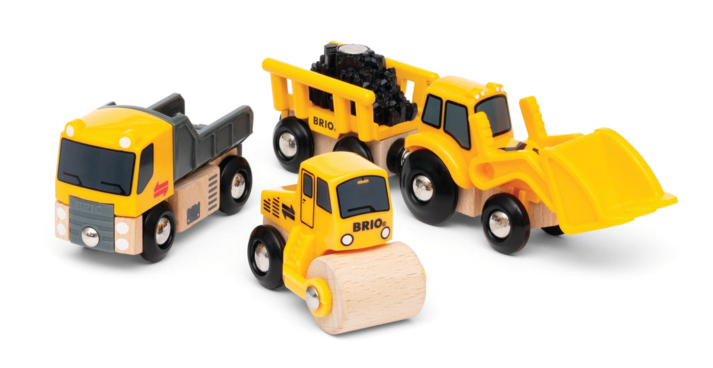 Three toy construction vehicles on a white background