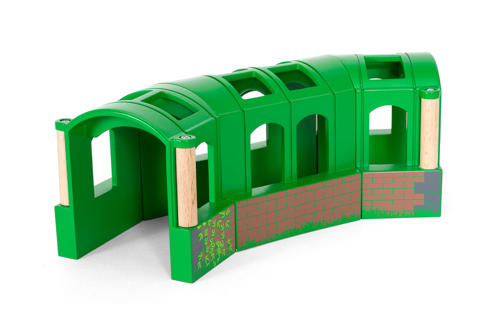 Green toy train bridge with wooden elements on a white background