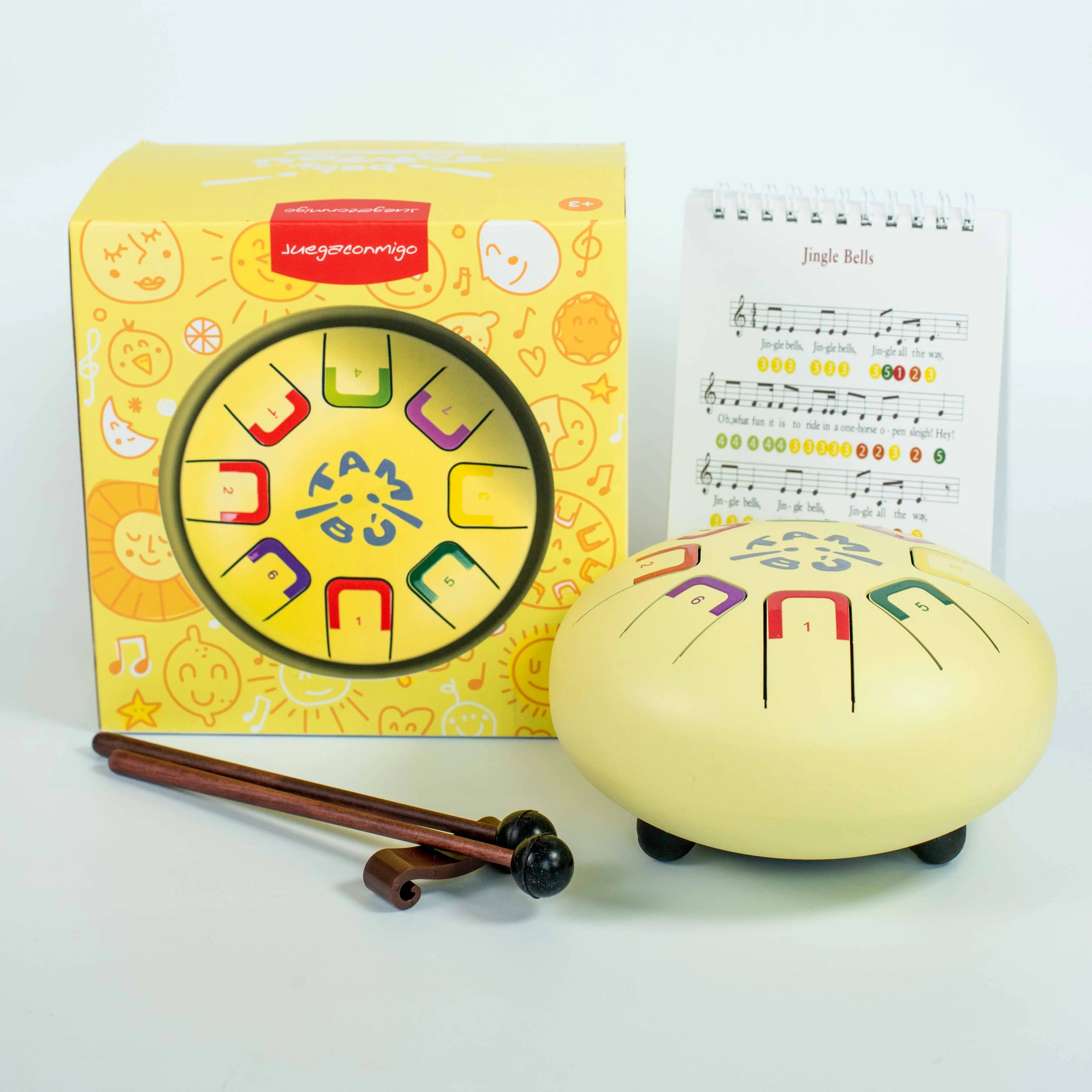 Children's musical instrument with packaging and music sheet on a white background