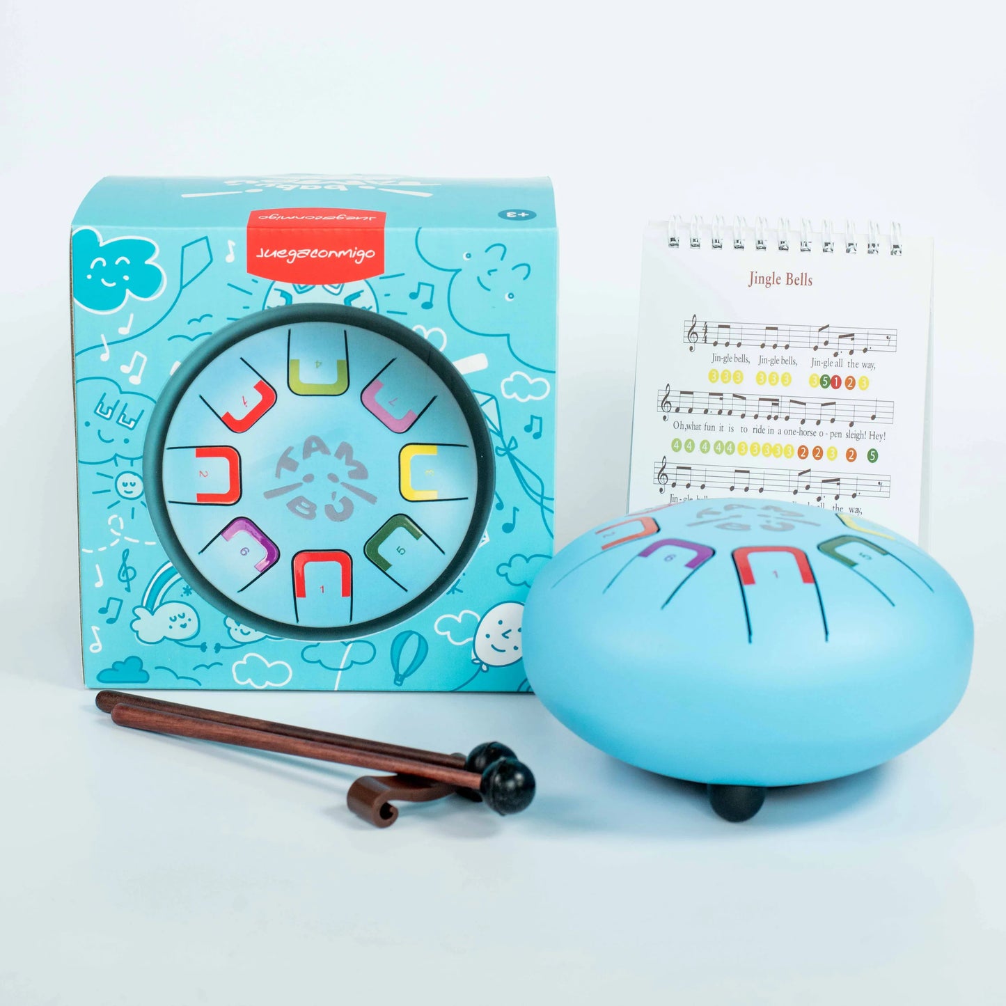 Blue jingle bell with music notes, packaging, and sheet music on a white background