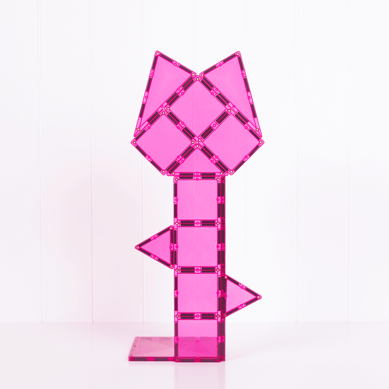Pink geometric block design on a white background