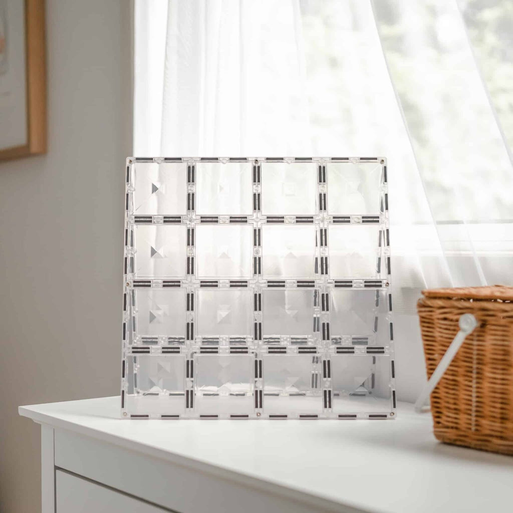 Clear magnetic tile base with geometric pattern on a white surface
