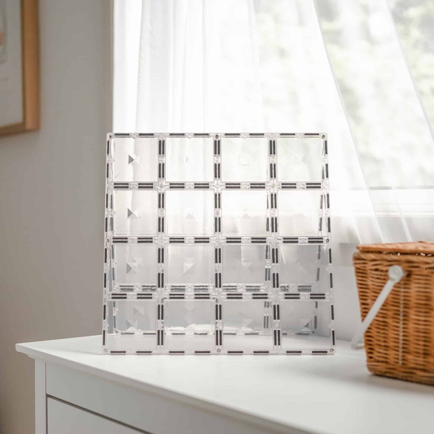 Clear magnetic tile base with geometric pattern on a white surface