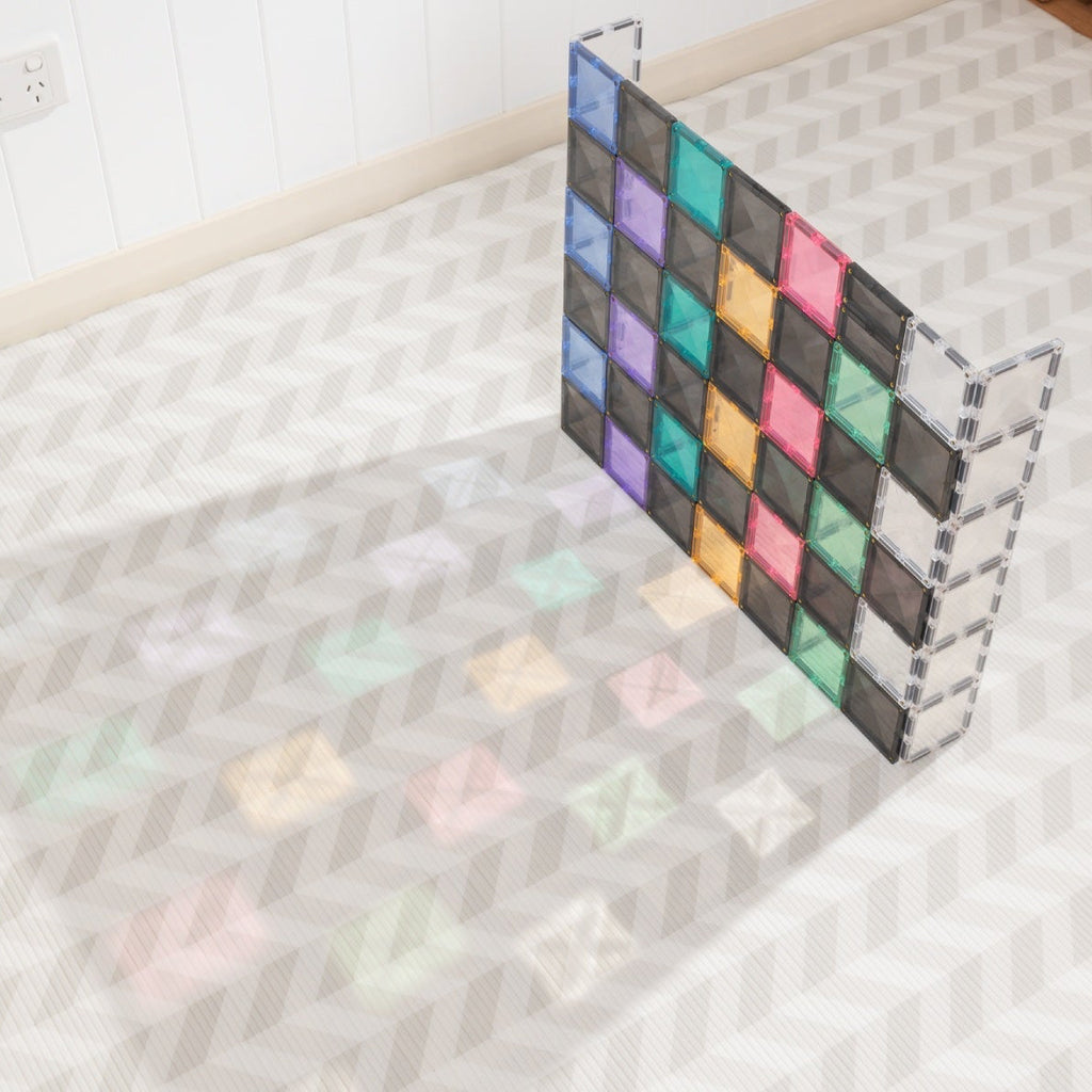 Colorful checkered mat on a textured floor