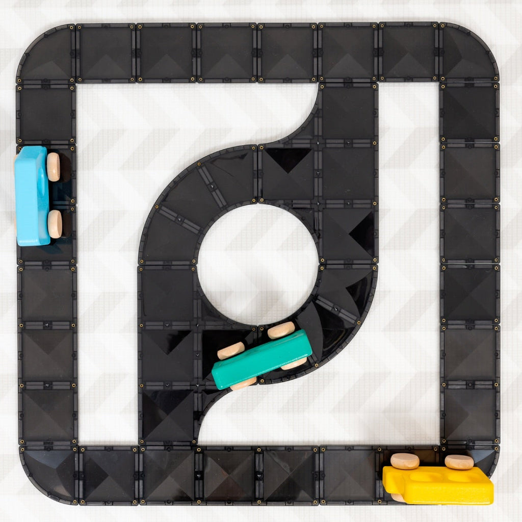 Black magnetic tiles with wooden cars
