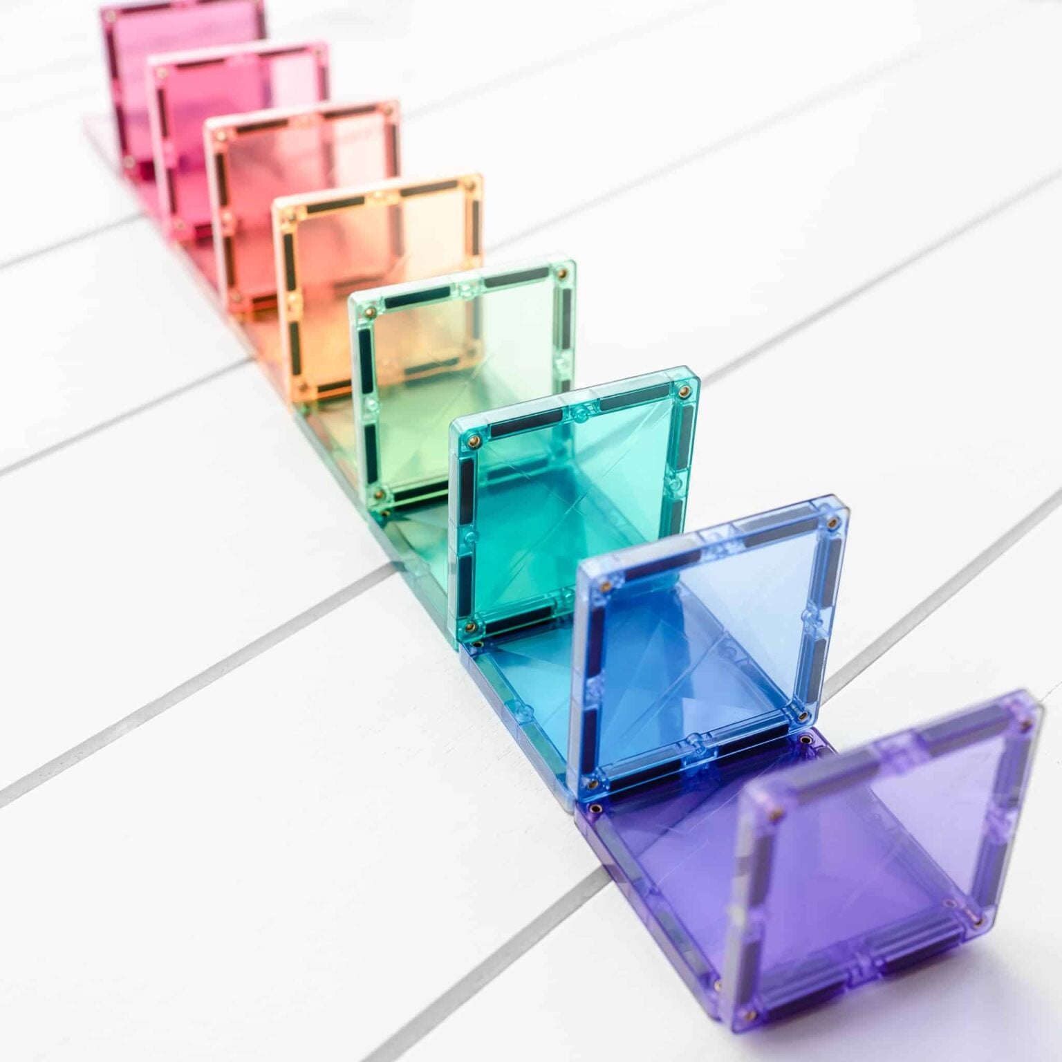 Colorful transparent square objects on a white surface
