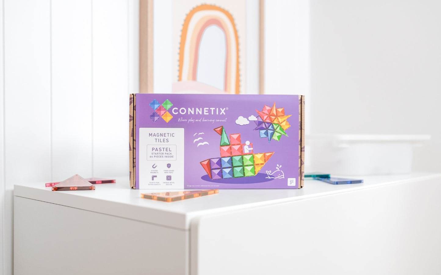 Connetix magnetic tiles packaging on a white surface with a white wall in the background