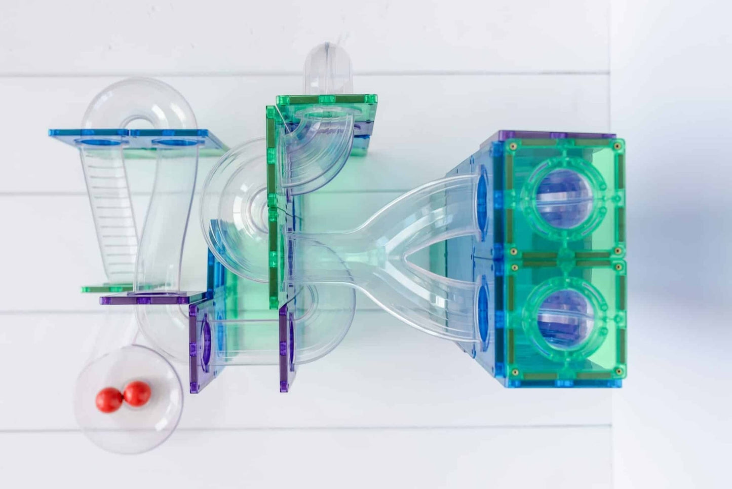 Colorful transparent plastic toy with a white background