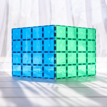 Blue and green transparent cube puzzle on a white background