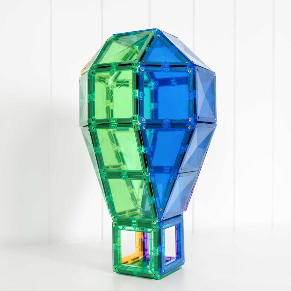 Colorful geometric transparent tower made of interlocking bricks on a white background
