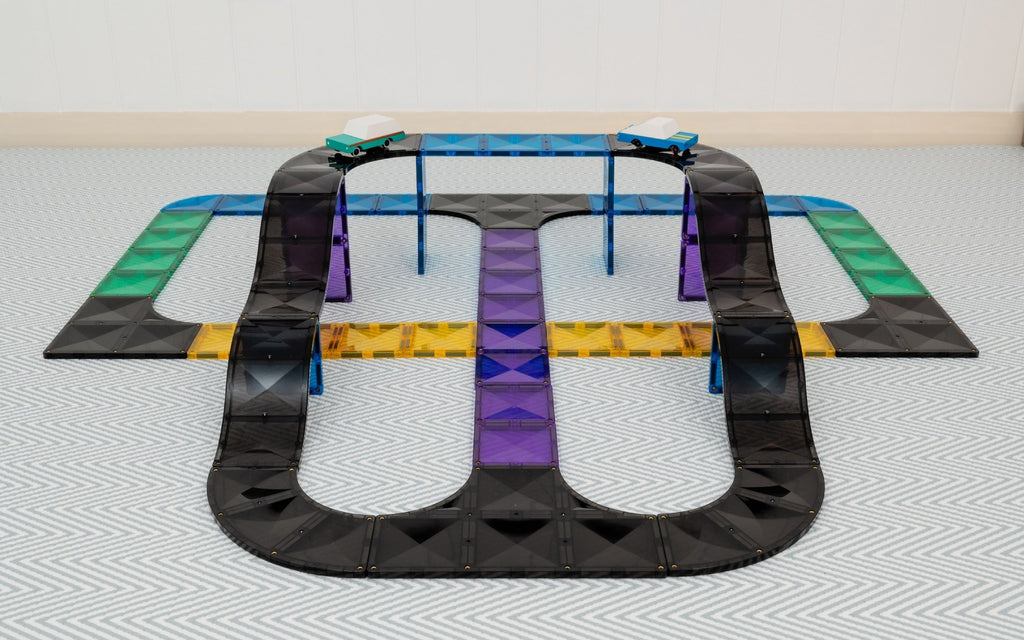 Toy track set on a flat surface with a white background