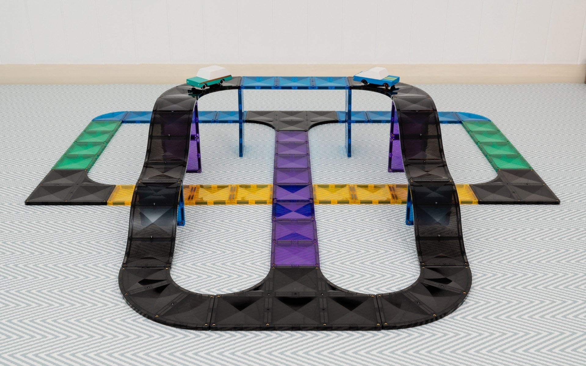 Toy track set on a flat surface with a white background