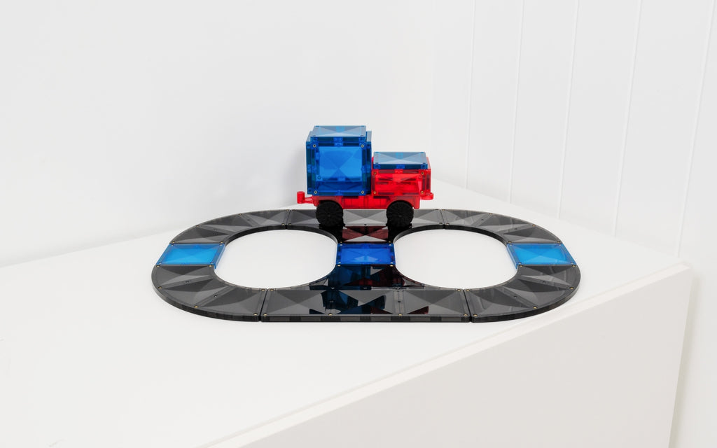 Toy truck on a transparent track with blue and red colors on a white background