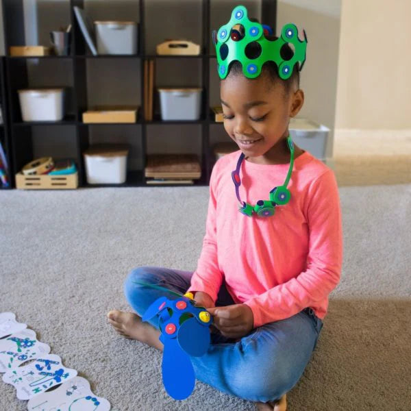 Child playing with colorful toys on a carpeted floor