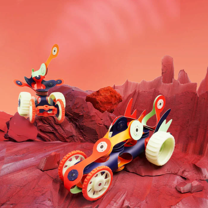 Toy vehicles on a red rocky landscape
