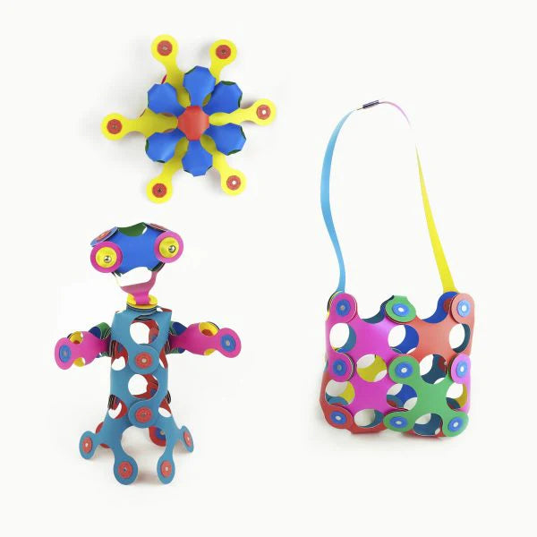 Colorful toy set with a robot, flower, and other shapes on a white background