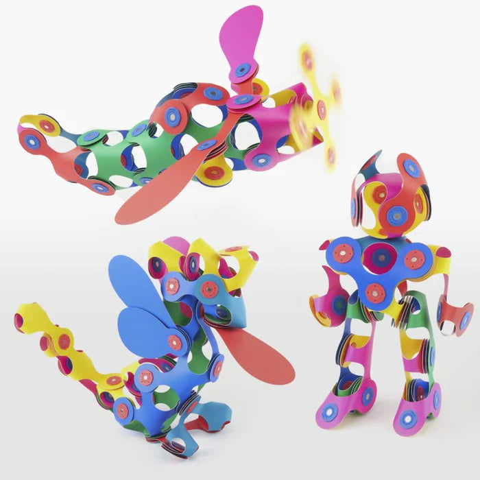 Colorful toy figure with propeller-like appendages on a white background